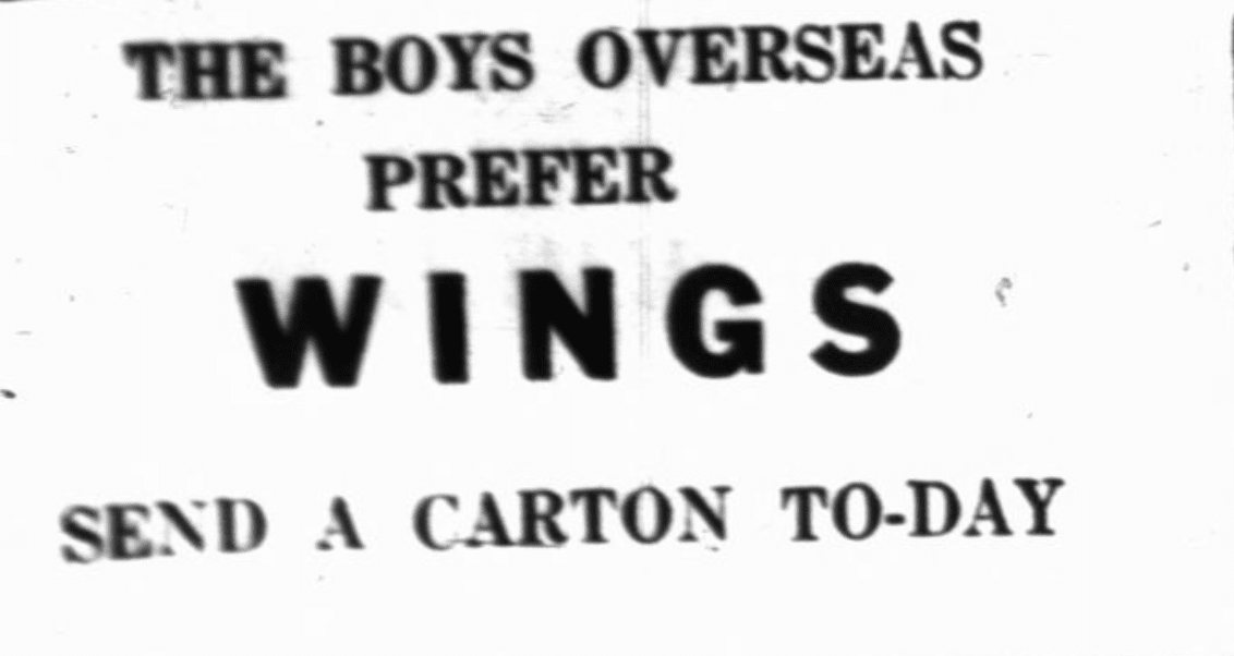 A newspaper headline in all capital letters reads: The Boys Overseas Prefer Wings Send a Carton Today. The word “Wings” is larger than the others and is bolded.